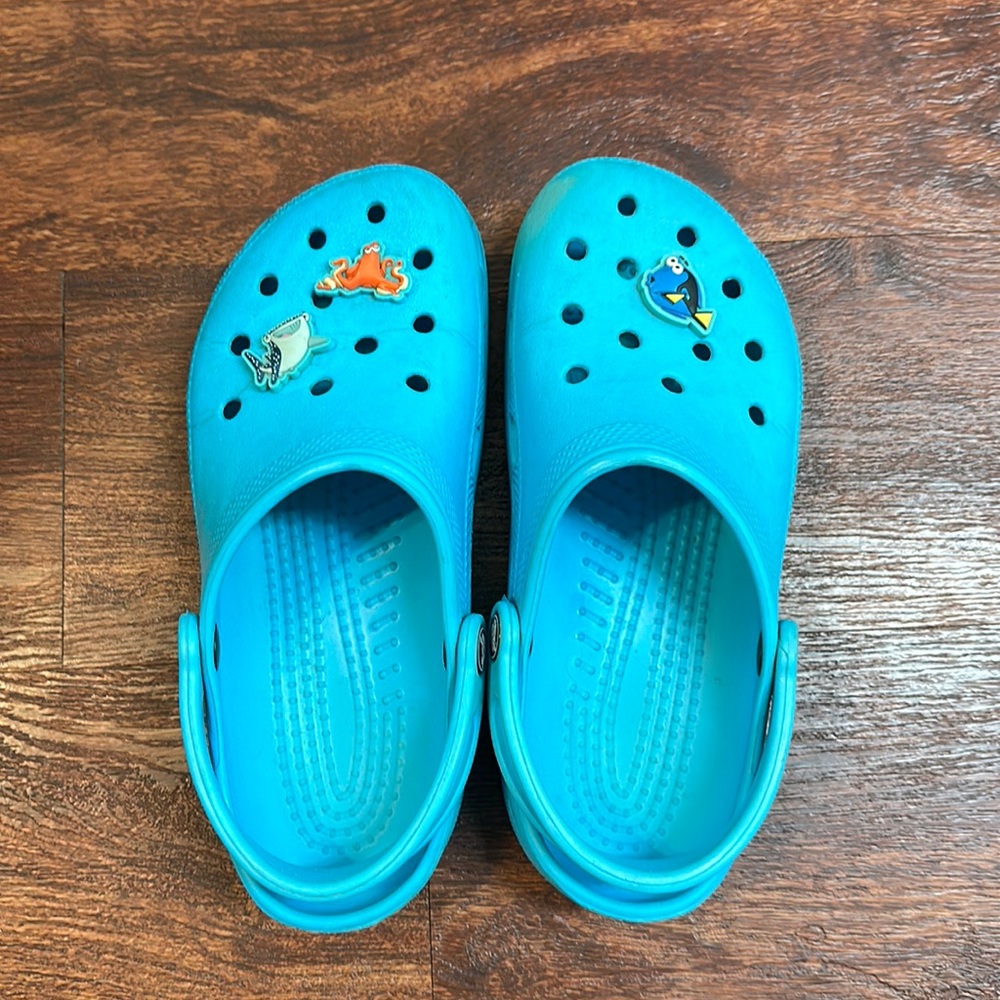 Light blue crocs with Finding Dory Jibbitz